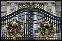 Entrance grids of Buckingham Palace with royalty emblems. London, England, United Kingdom