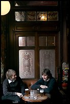 Young men, beer pints, and etched glass, pub Princess Louise. London, England, United Kingdom (color)