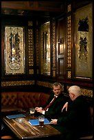 Business men talking over a beer, Victorian boozer Princess Louise. London, England, United Kingdom