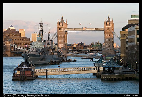 Historic boats, quays along the Thames, and Tower Bridge, late afternoon. London, England, United Kingdom (color)