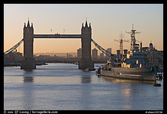 London Bridge, River Thames, and cruiser HMS Belfast at sunrise. London, England, United Kingdom