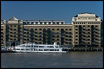 Butler Wharf and tour boat on the Thames. London, England, United Kingdom