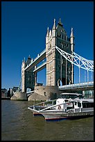 Catamaran below Tower Bridge. London, England, United Kingdom