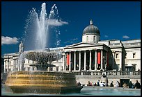 Fountain and National Gallery, Trafalgar Square, mid-day. London, England, United Kingdom (color)