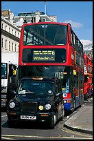 Taxi and double decker bus. London, England, United Kingdom (color)
