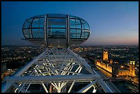 Millenium Wheel capsule and Houses of Parliament at dusk. London, England, United Kingdom ( color)