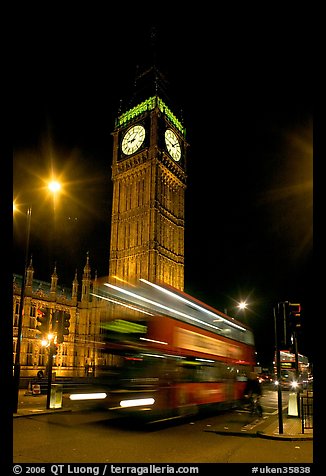 Big Ben and double decker bus in motion at nite. London, England, United Kingdom (color)