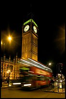 Big Ben and double decker bus in motion at nite. London, England, United Kingdom (color)