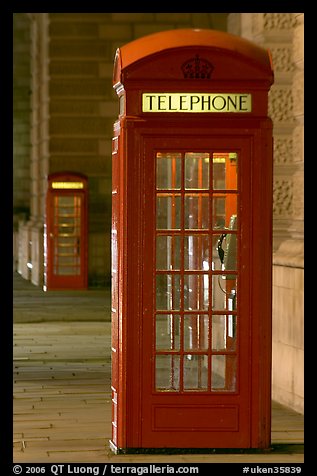 Red phone booth at night. London, England, United Kingdom