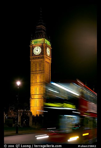 Double-decker bus in motion and Big Ben at night. London, England, United Kingdom