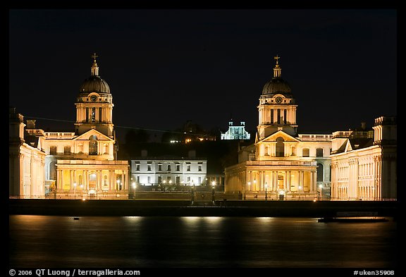 Old Royal Naval College, Queen's house, and Royal observatory with laser marking the Prime meridian at night. Greenwich, London, England, United Kingdom (color)