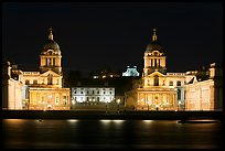 Old Royal Naval College, Queen's house, and Royal observatory with laser marking the Prime meridian at night. Greenwich, London, England, United Kingdom