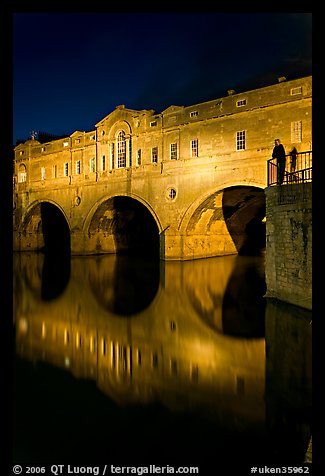 Man looking at the Pulteney Bridge  at night. Bath, Somerset, England, United Kingdom (color)