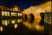Pulteney Bridge, and quay reflected in River Avon at night. Bath, Somerset, England, United Kingdom (color)