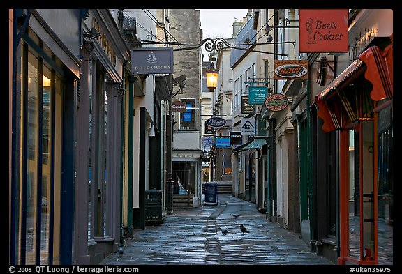 Shops lining narrow street. Bath, Somerset, England, United Kingdom