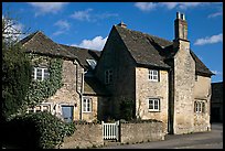 Houses with roofs made from split natural stone tiles, Lacock. Wiltshire, England, United Kingdom (color)