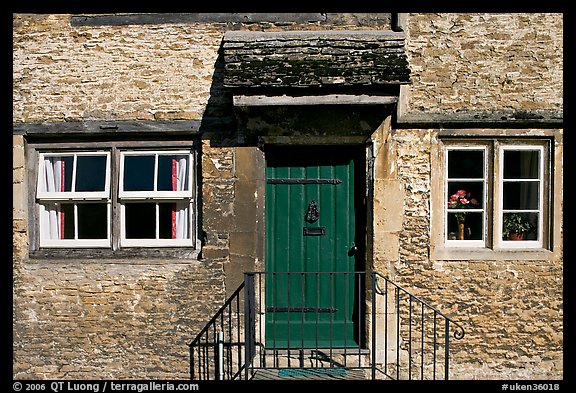 Windows and doorway entrance of stone house, Lacock. Wiltshire, England, United Kingdom (color)