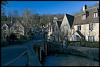 Packbridge crossing the Bybrook River and main street, Castle Combe. Wiltshire, England, United Kingdom (color)