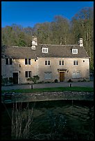 Cotswold type houses and Bybrook River, Castle Combe. Wiltshire, England, United Kingdom ( color)
