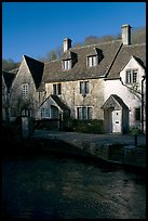 Cotswold type cottages and Bybrook River, Castle Combe. Wiltshire, England, United Kingdom