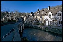 Main village street and Bybrook River, late afternoon, Castle Combe. Wiltshire, England, United Kingdom