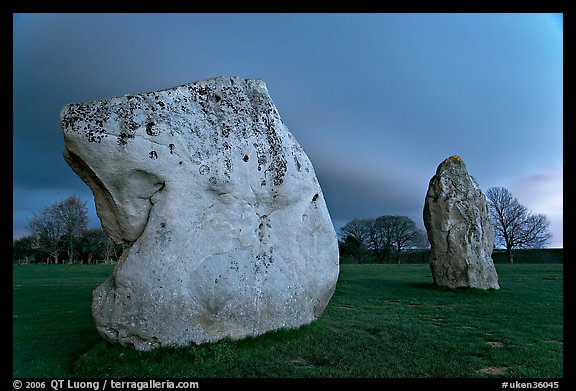 Large standing stones and brewing storm at dusk, Avebury, Wiltshire. England, United Kingdom