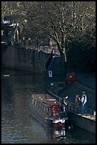 Family stepping out of houseboat onto quay. Bath, Somerset, England, United Kingdom (color)