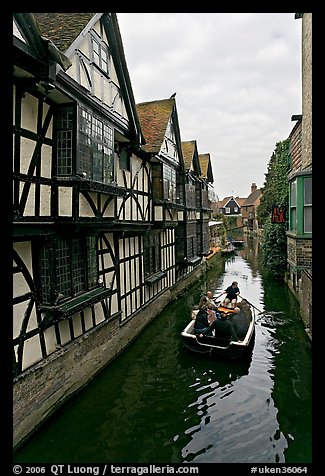 Half-timbered house, canal, and rowboat. Canterbury,  Kent, England, United Kingdom