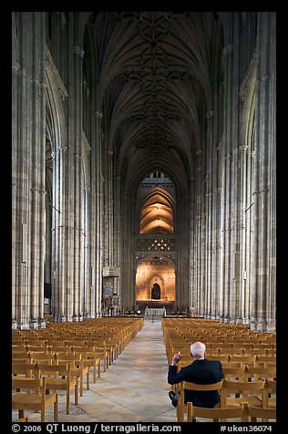 Man sitting in the Nave of the Canterbury Cathedral. Canterbury,  Kent, England, United Kingdom