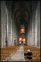Man sitting in the Nave of the Canterbury Cathedral. Canterbury,  Kent, England, United Kingdom