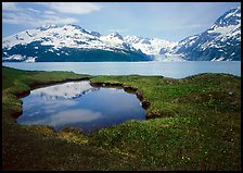 Pond, mountains, and glaciers across Harriman Fjord. Prince William Sound, Alaska, USA