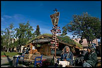 Native people sitting in front of visitor center. Anchorage, Alaska, USA