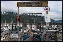 Ramp to harbor deck with Whittier sign. Whittier, Alaska, USA