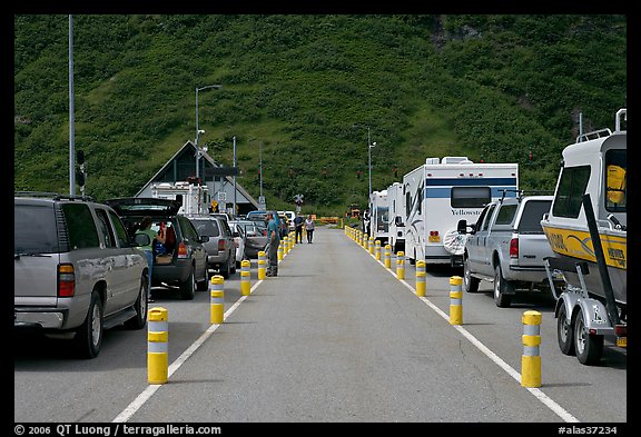 Cars and RVs lining up for the tunnel crossing. Whittier, Alaska, USA (color)