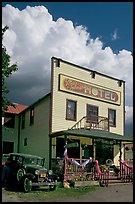 Ma Johnson hotel with classic car parked by, afternoon. McCarthy, Alaska, USA (color)