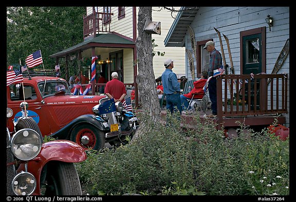 Vintage cars and houses on main street. McCarthy, Alaska, USA (color)