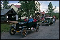 Classic cars driven on main street. McCarthy, Alaska, USA