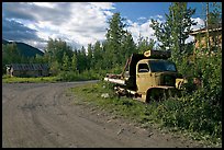 Side street with wrecked truck. McCarthy, Alaska, USA