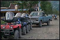 Four wheelers parked on main street. McCarthy, Alaska, USA (color)