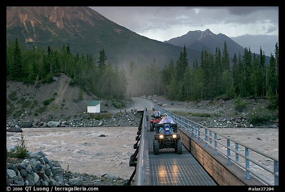 Four wheeler crossing the footbridge. McCarthy, Alaska, USA (color)