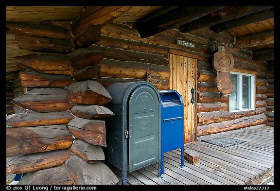 Mail boxes, log house postal office, Slana. Alaska, USA (color)