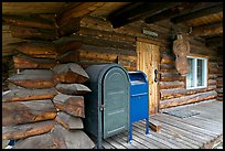 Mail boxes, log house postal office, Slana. Alaska, USA