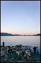 Family enjoying midnight picknik, Resurrection Bay, sunset. Seward, Alaska, USA (color)