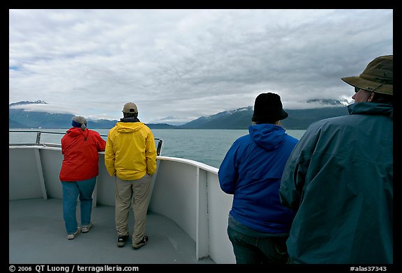 Passengers standing on deck with colorful  clothes. Seward, Alaska, USA