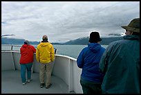 Passengers standing on deck with colorful  clothes. Seward, Alaska, USA (color)