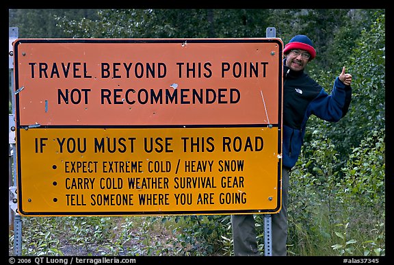 Sign with warnings about winter travel, Exit Glacier Road. Seward, Alaska, USA (color)