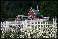 Flowers, white picket fence and church. Seward, Alaska, USA (color)