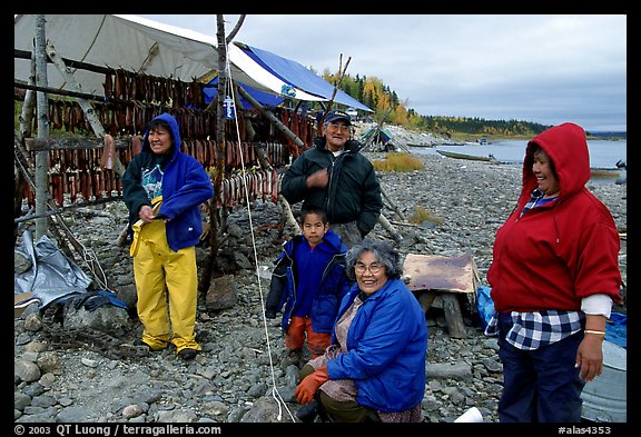 Inupiaq Eskimo family with stand of drying fish, Ambler. North Western Alaska, USA (color)