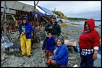 Inupiaq Eskimo family with stand of drying fish, Ambler. North Western Alaska, USA