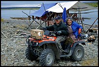 Inupiaq Eskimo man and woman riding on a four-wheeler, Ambler. North Western Alaska, USA